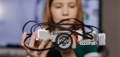 a girl holding a toy car