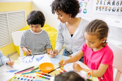 boy and girl doing painting